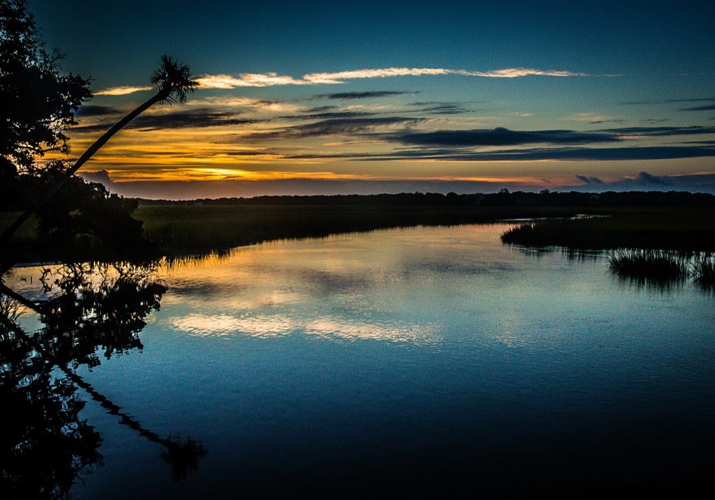Sunrise reflected in marsh water at Edisto Beach State Park